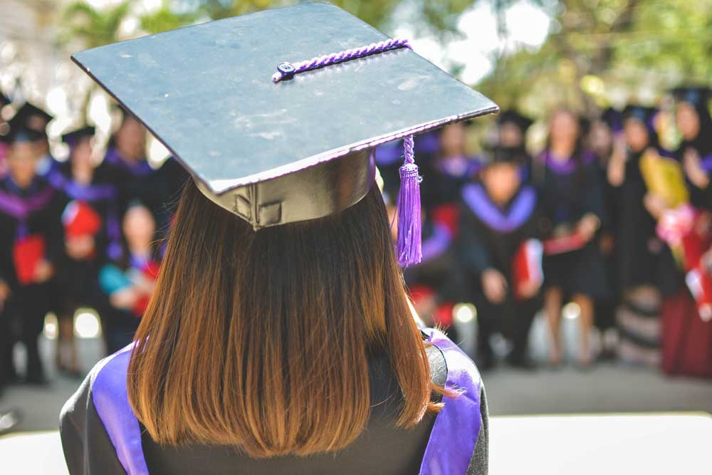 Graduate in cap and gown