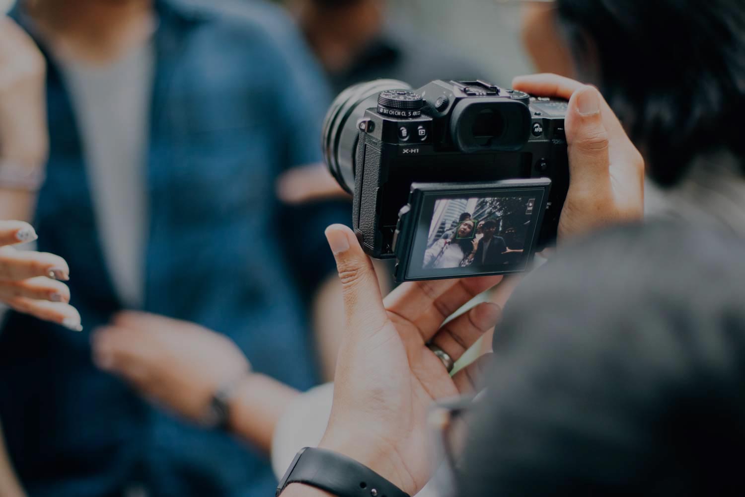 Hands holding a camera